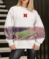 Nebraska Cornhuskers fleece pullover with relaxed fit, drop shoulders, and bold allover print. Cozy gameday sweatshirt with standout style.