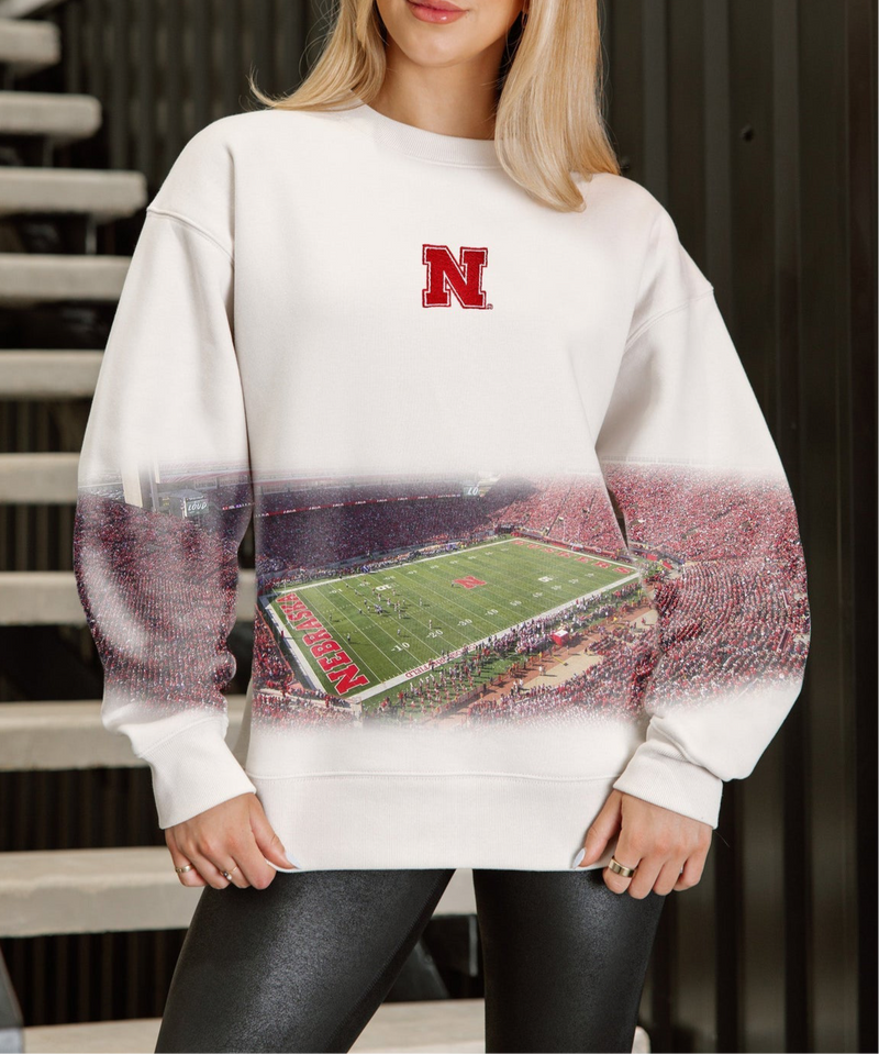 Nebraska Cornhuskers fleece pullover with relaxed fit, drop shoulders, and bold allover print. Cozy gameday sweatshirt with standout style.